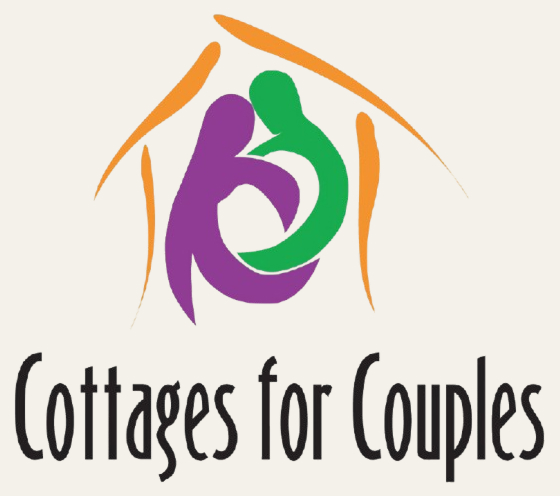 White logo for "Cottages for Couples" featuring abstract figures of two people embracing under a stylised roof.